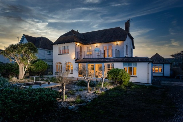luxury-coastal-residence-exterior-evening-architectural-windows