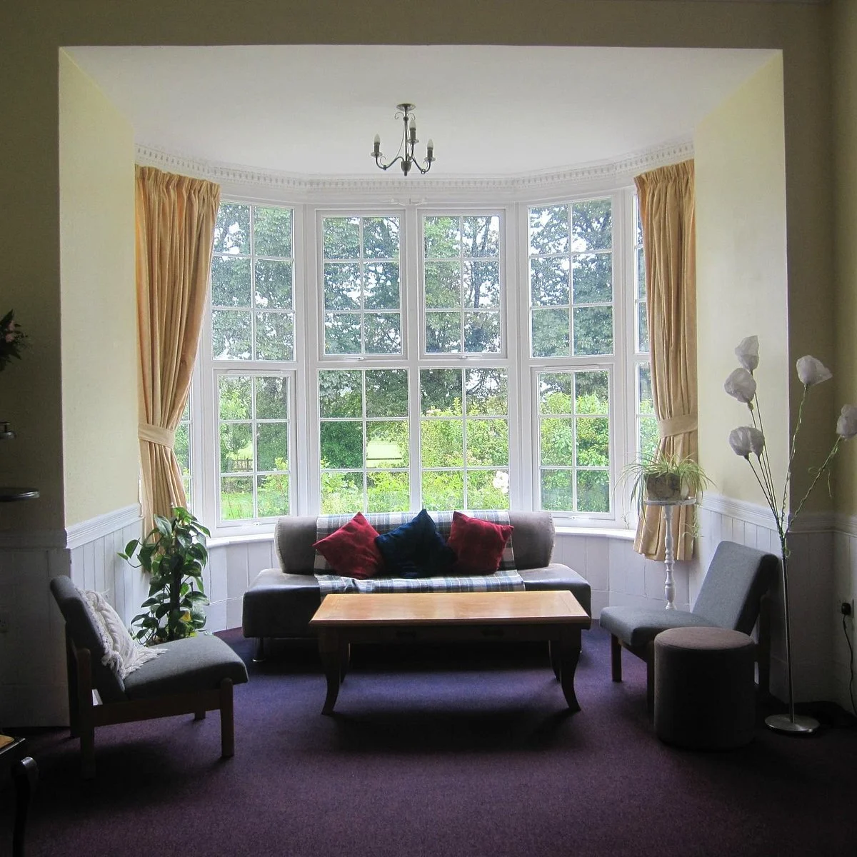 victorian-bay-window-sitting-room-yellow-curtains